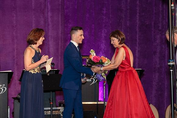 Aaron Emig presents Chrystal Award to Beth Johstrand