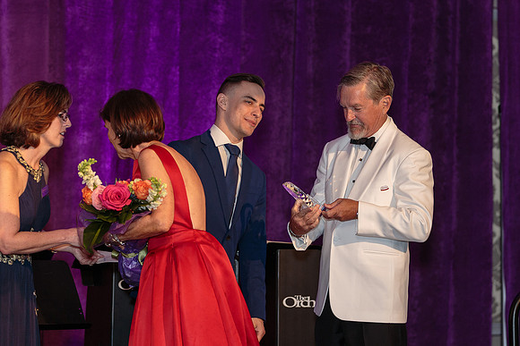 Arron Emig presents Crystal Award to John Johstrand