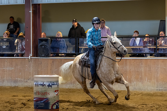 Evan McKay riding Juice in Barrel Racing