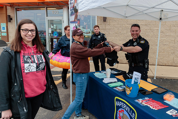 Athlete Melanie Mayer with the Naperville Police for the Cop On