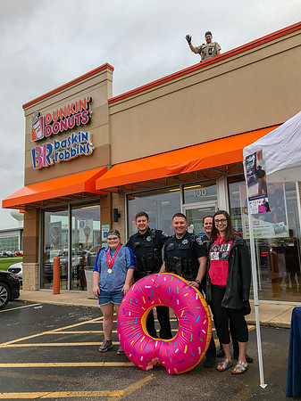 Anne Hamilton and Melanie Mayer with Npaerville Police at Cop on